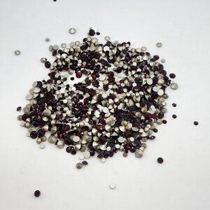 assorted loose burgundy swarovski rhinestones
